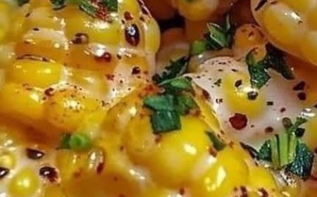 Corn cooked in a skillet with honey and butter.