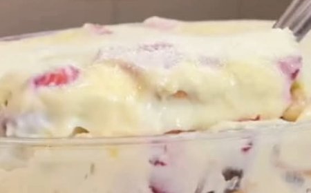 Layered dessert with cream, biscuits and fruits