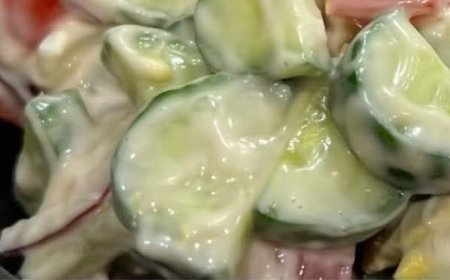 sliced tomatoes and cucumbers marinated in olive oil